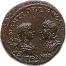 AE 12 280-190 v.chr. Kopf des Apollon/Antiochos III. mit Diadem n.r. Rs.: Fackel zwischen zwei Pilei (Dioskuren-Kappen). 1.57 g.