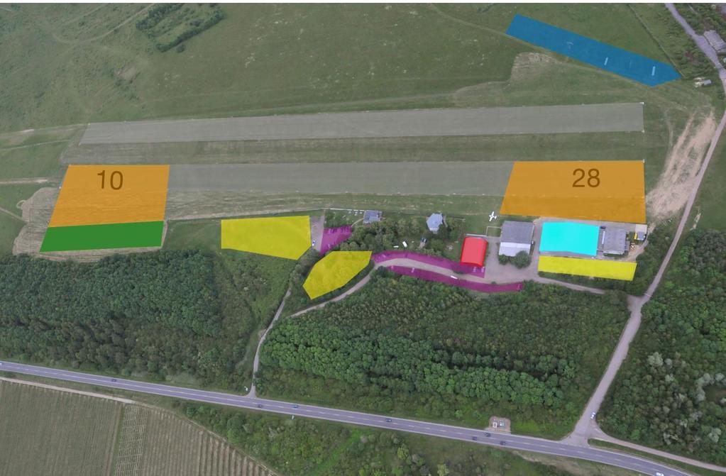 3 Lageplan Campingplätze (gelb), Briefinghalle (rot), Hänger- und Flugzeugabstellplatz (15m-Klasse blau, Clubklasse grün), Aufbauzone (orange).