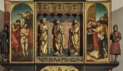 Den lebendigen Eindruck der aus Holz geschnitzten Figur verstärkt ihre feine farbige Fassung, echtes Gold signalisiert die Heiligkeit des Dargestellten. Dem Kirchenpatron von St.