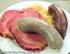 Speisen. Schlachtplatte (Kassler, Leber- und Blutwurst) mit Sauerkraut und Schupfnudeln 10,80
